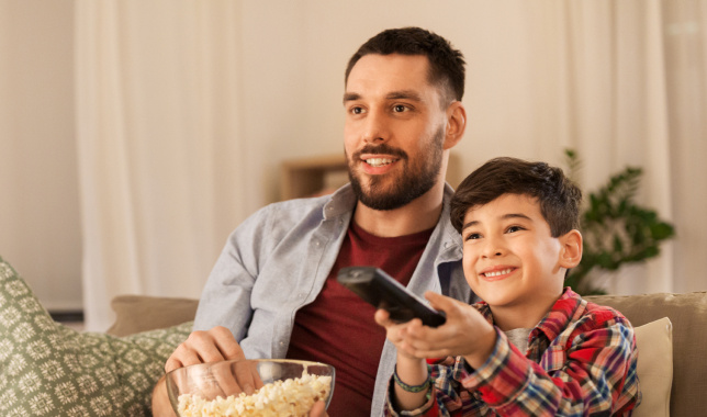 Father and son watching a movie_