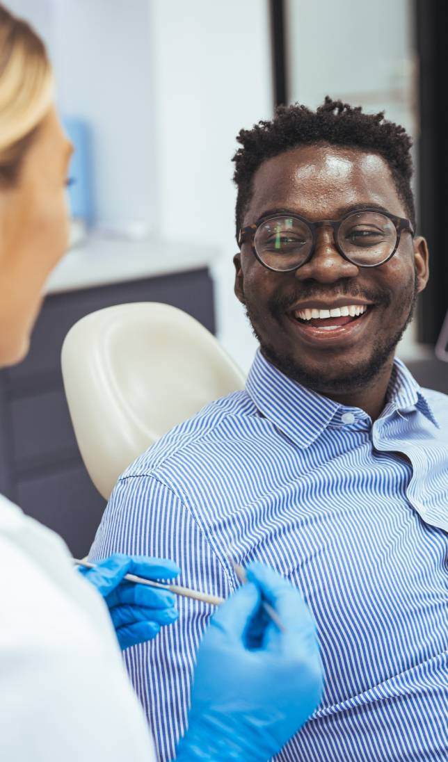 Man speaking to dentist