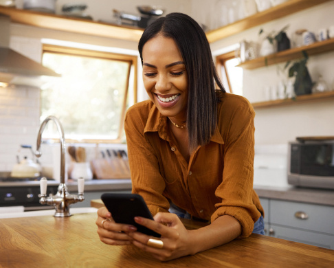 Woman on phone in kitchen